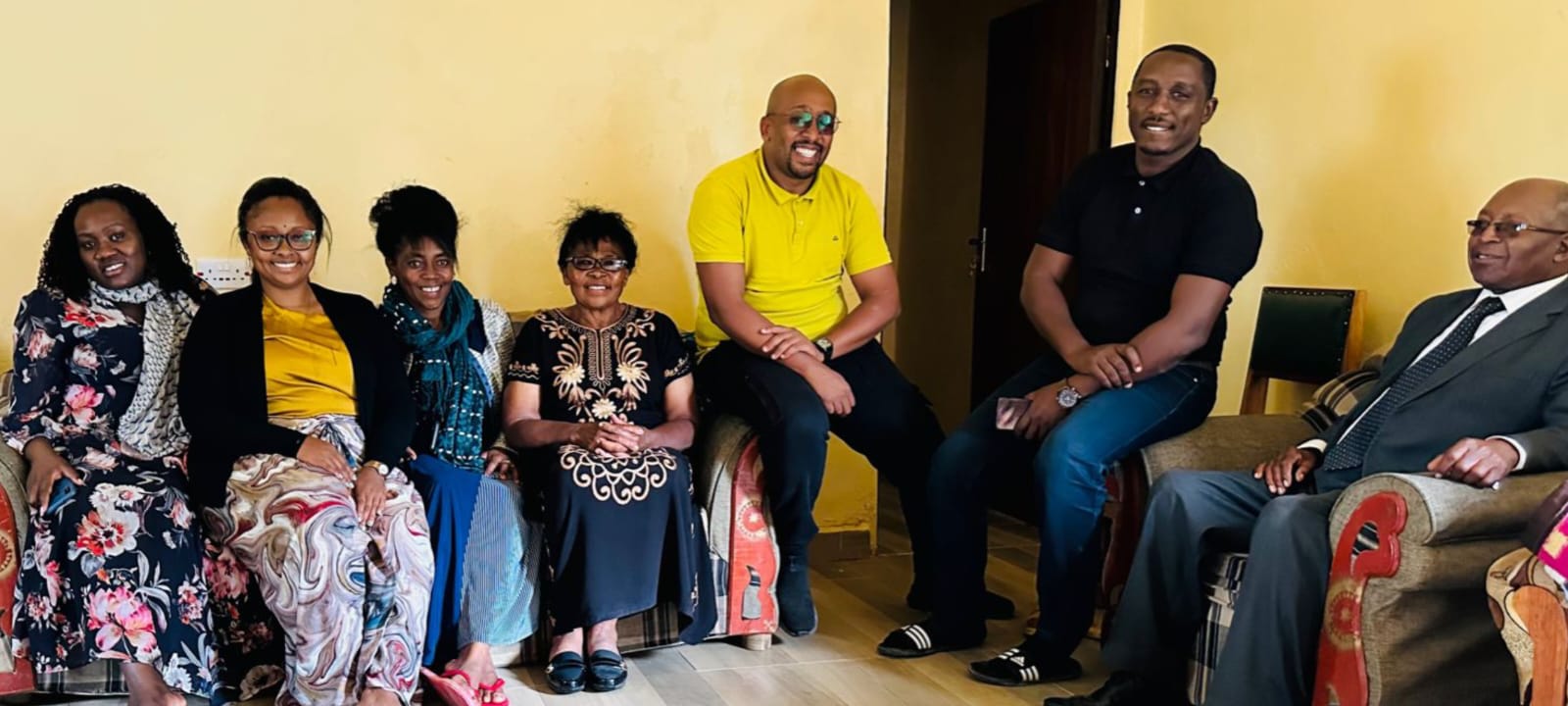Family together at home — laughter in the living room.